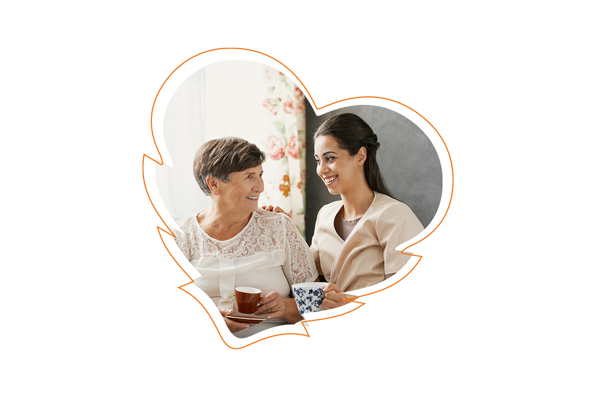 The image depicts two individuals, likely a woman and an older adult, sharing a warm moment with a cup of tea between them, set against a blurred background that suggests a cozy home environment.